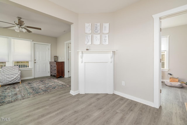 interior space with ceiling fan and light wood-type flooring