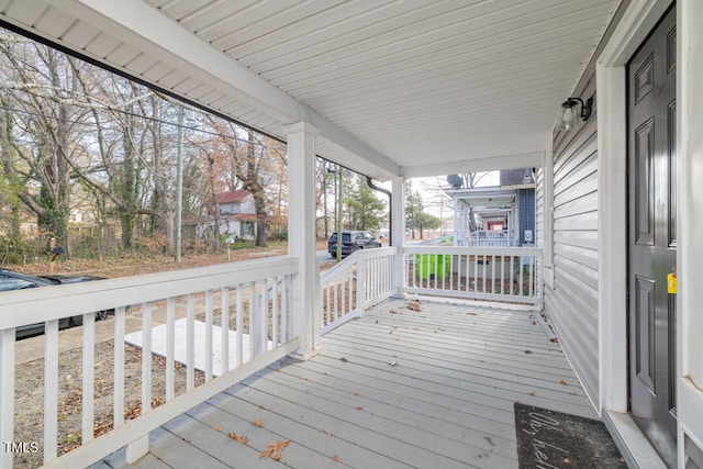 wooden deck featuring covered porch