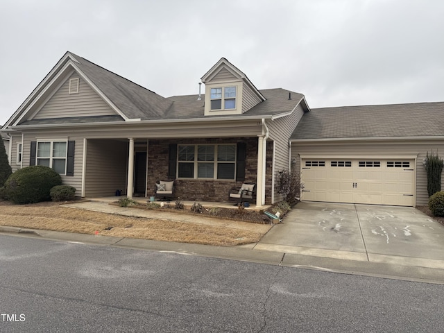 view of front facade featuring a garage and a porch