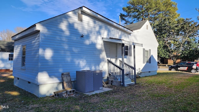 view of side of home with cooling unit