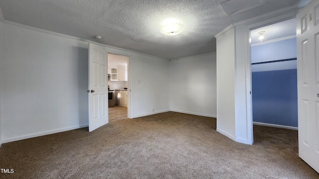 unfurnished bedroom with carpet, a textured ceiling, and ornamental molding