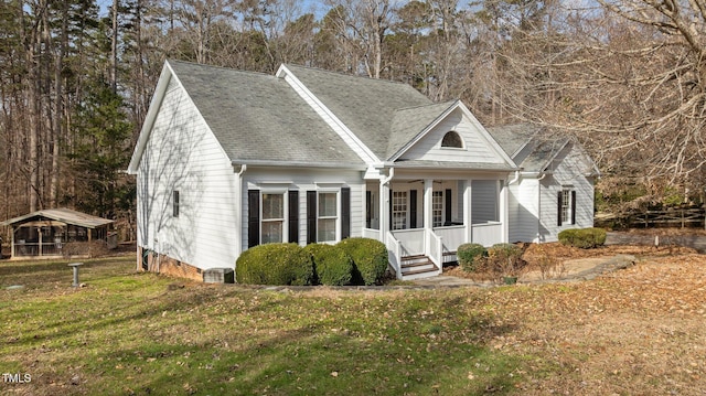 view of front of home featuring a front lawn and a porch