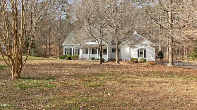 view of front of property with a front yard and a porch