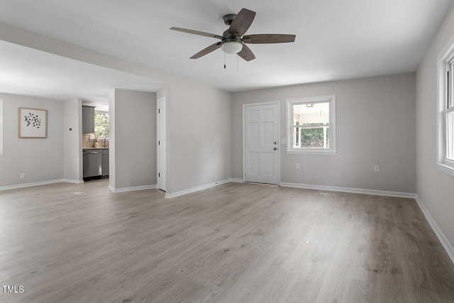 unfurnished living room featuring ceiling fan and light hardwood / wood-style flooring