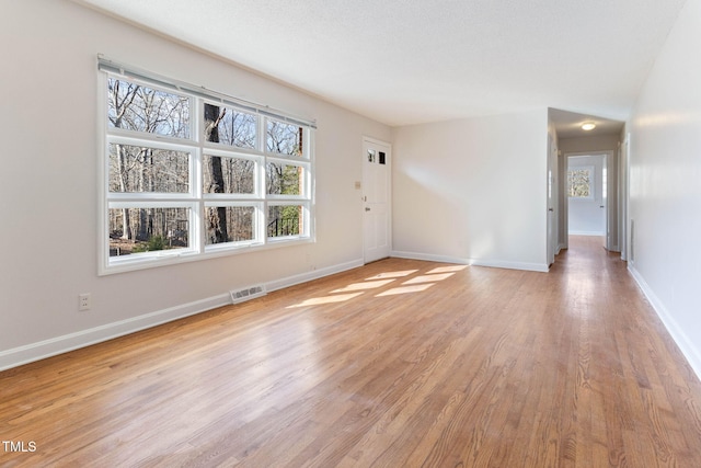 empty room with light wood-type flooring