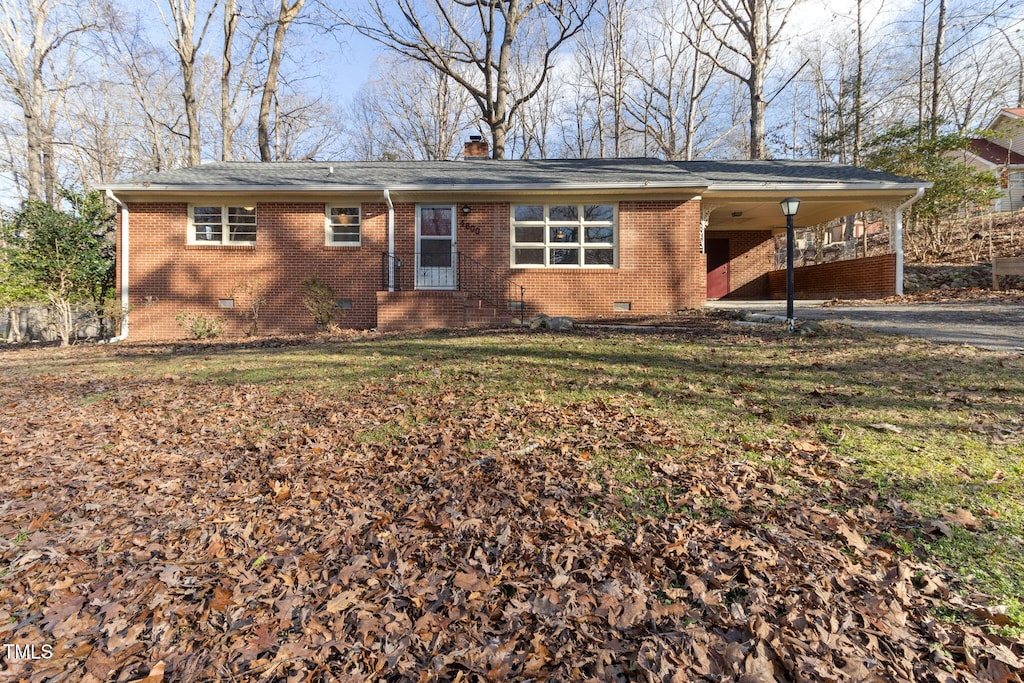 ranch-style home with a carport