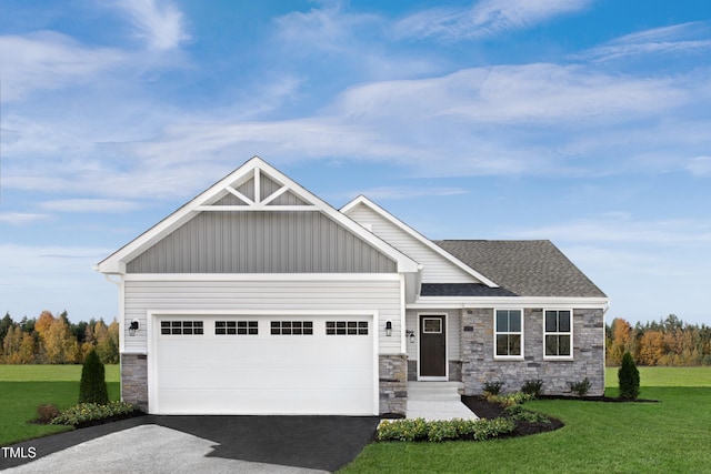 craftsman-style home with a front lawn and a garage