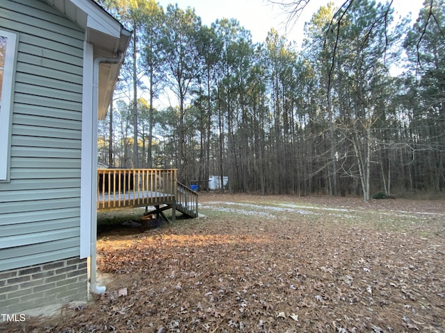 view of yard with a deck