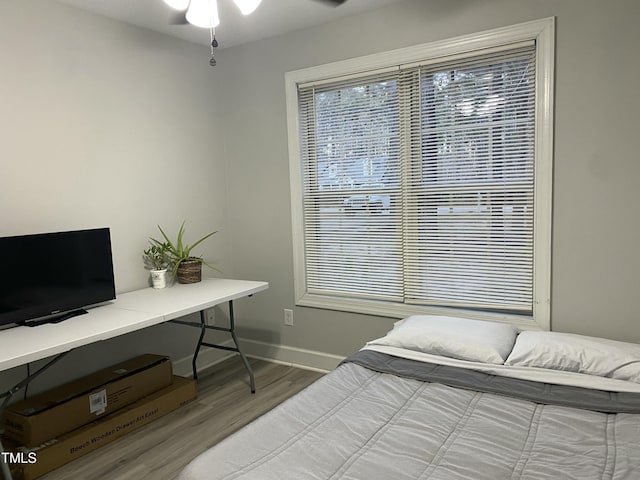 bedroom with hardwood / wood-style floors