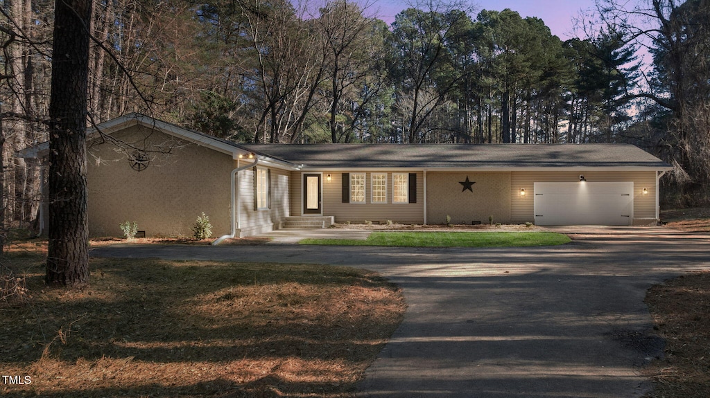 ranch-style home with a garage