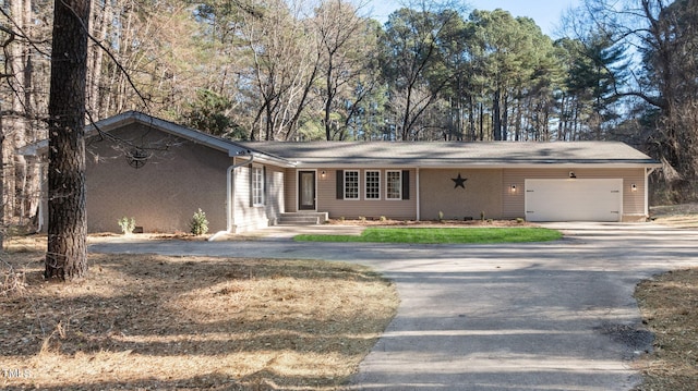 ranch-style home with a garage