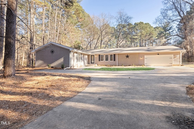 single story home with a garage and a carport