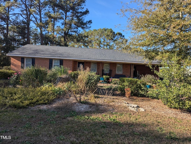 single story home with brick siding