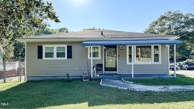 bungalow-style home with a front lawn