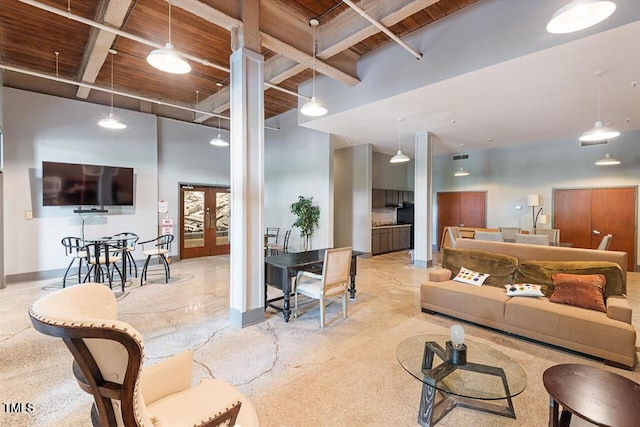 living room with a high ceiling, french doors, wooden ceiling, and beamed ceiling