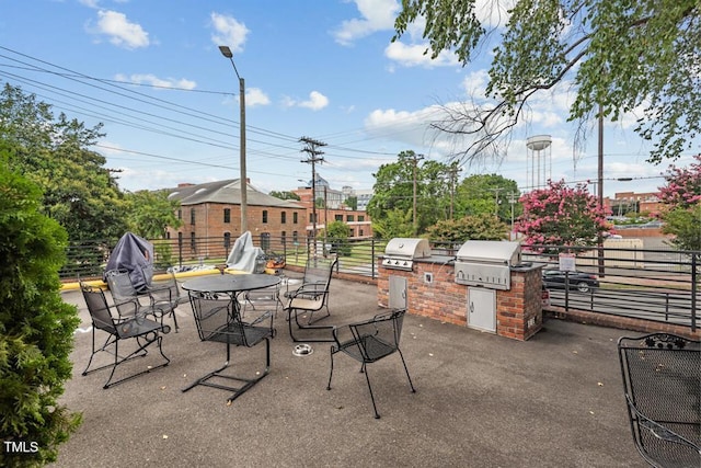 view of patio / terrace with area for grilling and an outdoor kitchen