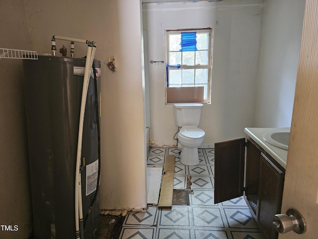 bathroom with vanity, toilet, and water heater