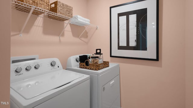 clothes washing area featuring washing machine and clothes dryer