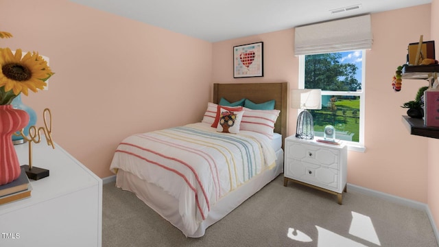 bedroom featuring light colored carpet