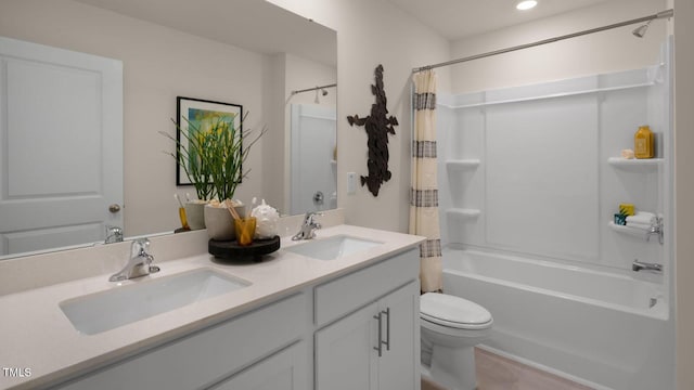 full bathroom with toilet, shower / bath combo with shower curtain, and vanity