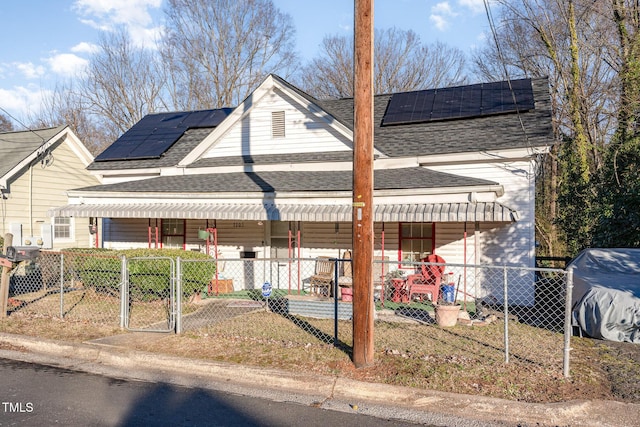 exterior space with solar panels and covered porch