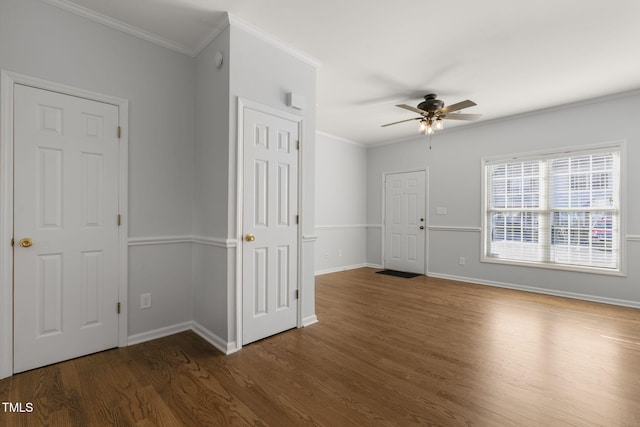 spare room with ceiling fan, dark hardwood / wood-style floors, and ornamental molding