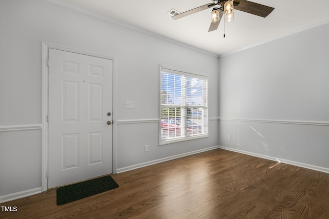 entrance foyer with dark hardwood / wood-style flooring, ceiling fan, and crown molding