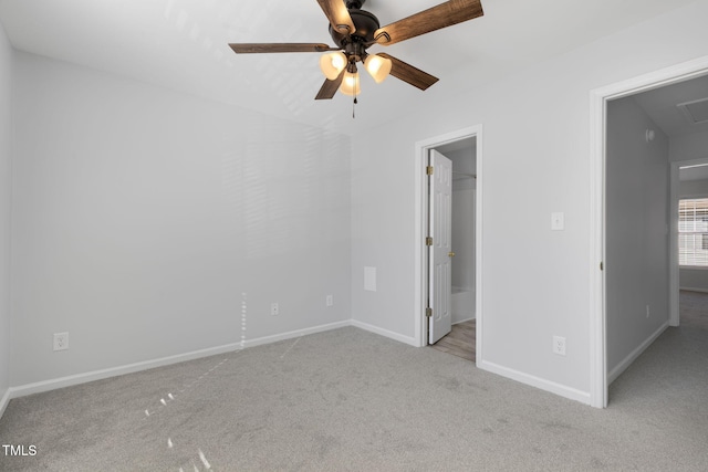 unfurnished bedroom featuring light carpet and ceiling fan