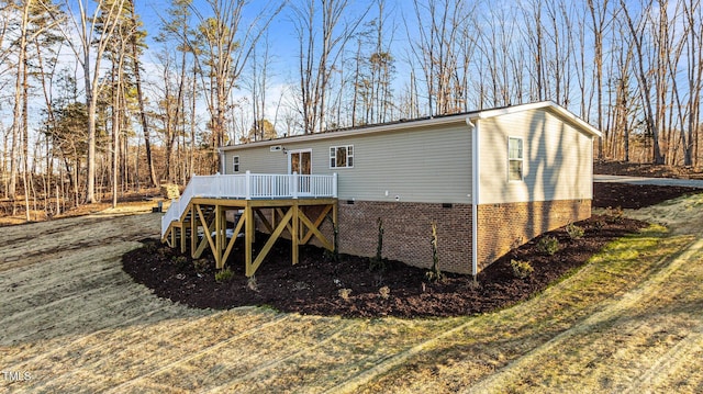 back of house featuring a deck