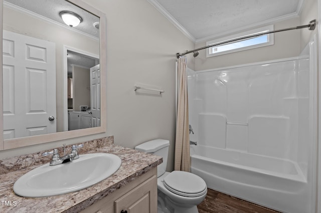 full bathroom featuring shower / tub combo with curtain, toilet, crown molding, a textured ceiling, and vanity