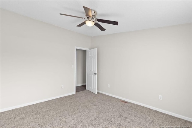 carpeted empty room with ceiling fan