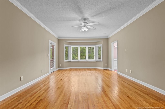 unfurnished room with a textured ceiling, ceiling fan, crown molding, and light hardwood / wood-style flooring