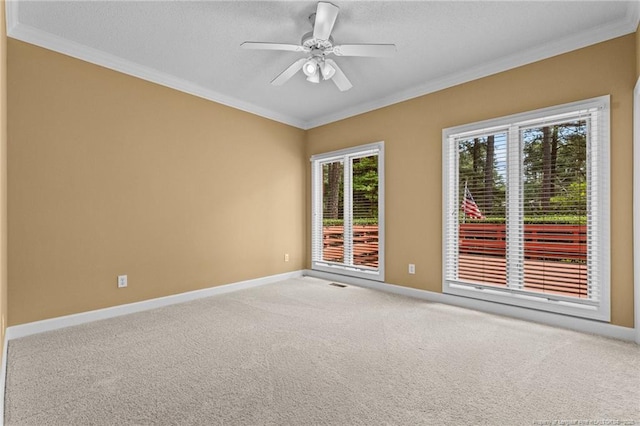 unfurnished room featuring ceiling fan, crown molding, and carpet flooring