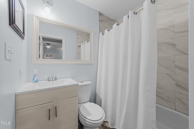 full bathroom featuring shower / bathtub combination with curtain, vanity, toilet, and a textured ceiling