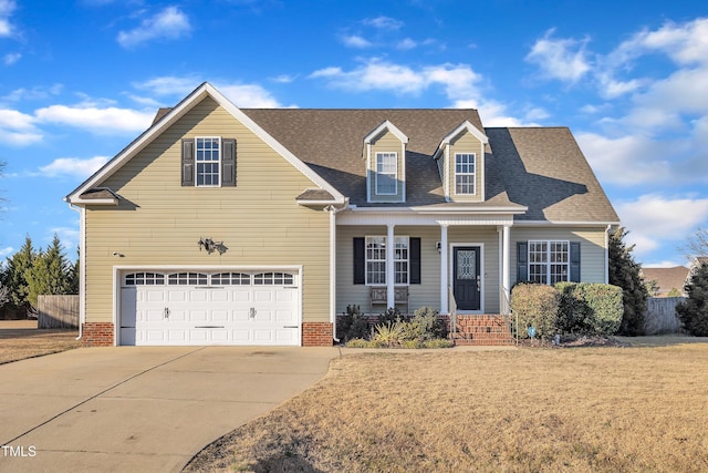 view of front facade with a garage and a front lawn