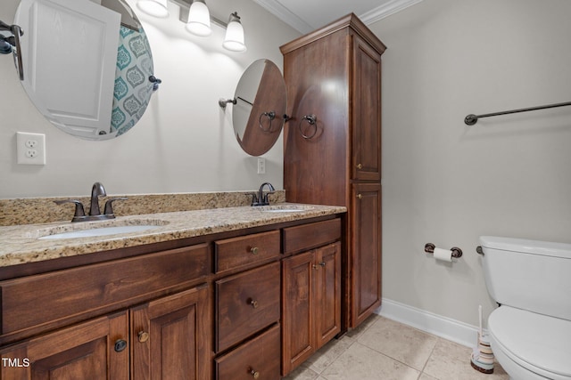 bathroom with toilet, tile patterned flooring, vanity, and crown molding