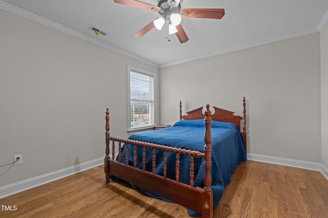 bedroom featuring wood-type flooring, ceiling fan, and ornamental molding