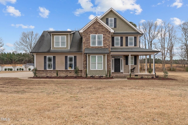 view of front of property featuring a porch and a front lawn