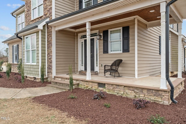 property entrance featuring covered porch