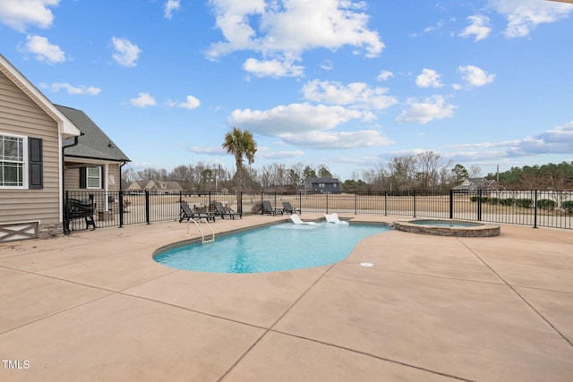 view of swimming pool featuring an in ground hot tub and a patio