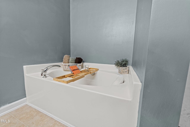 bathroom featuring a bathtub and tile patterned flooring