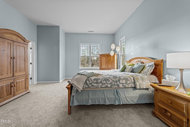 bedroom with light colored carpet