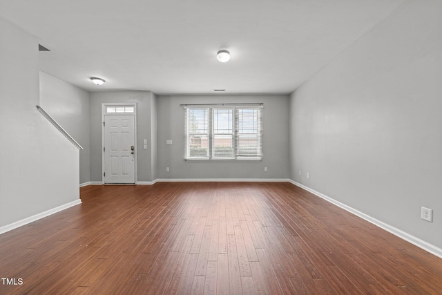 entrance foyer with dark hardwood / wood-style flooring