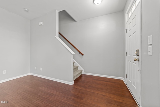 entryway with dark wood-type flooring