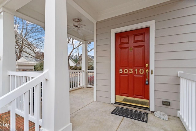 view of exterior entry with ceiling fan