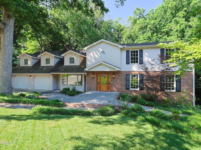 view of front facade with a garage and a front lawn