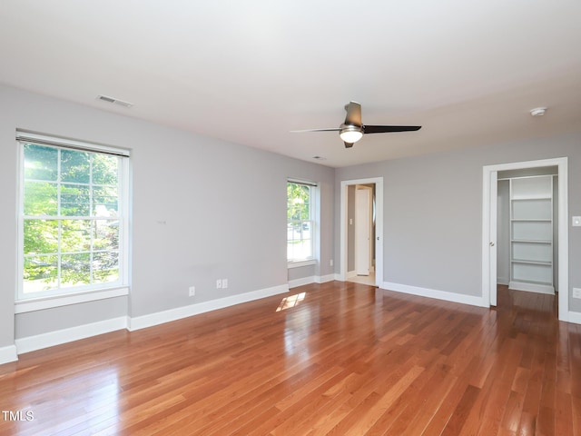 empty room featuring hardwood / wood-style flooring and ceiling fan