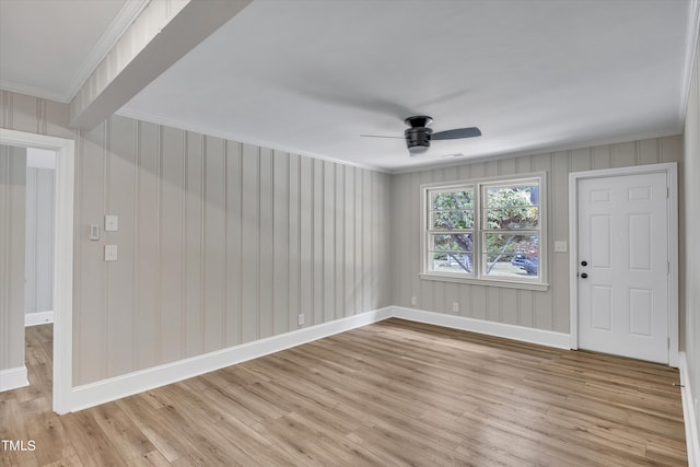 unfurnished room featuring ceiling fan, crown molding, and light hardwood / wood-style floors