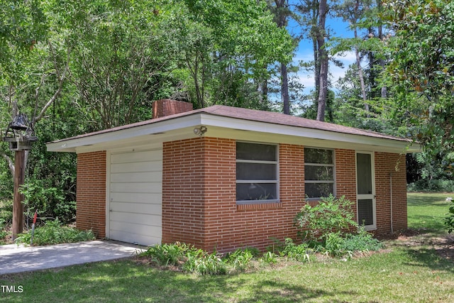 view of side of home with a yard