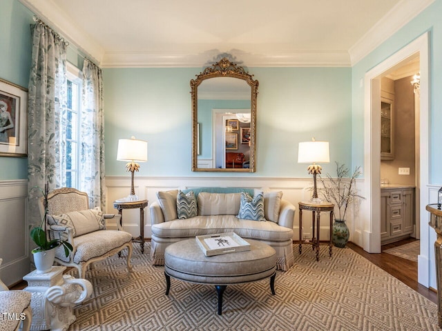 living area featuring crown molding and hardwood / wood-style floors